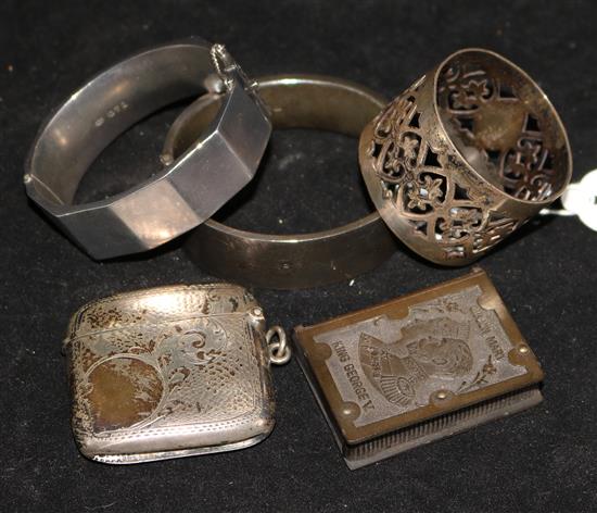 Two silver bangles, a vesta, napkin ring and a bakelite commemorative vesta.